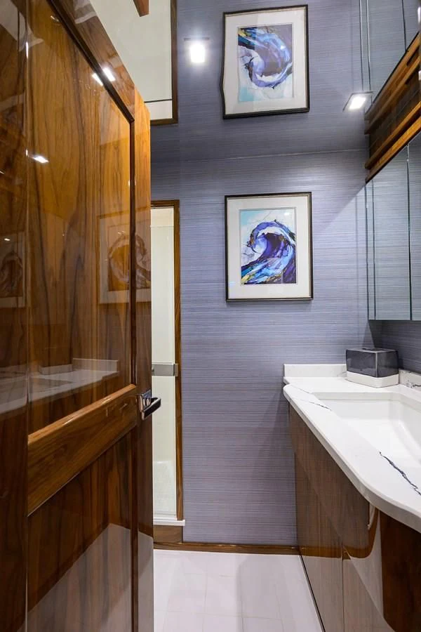a bathroom with a sink and a mirror aboard FORTY NINER Yacht for Sale