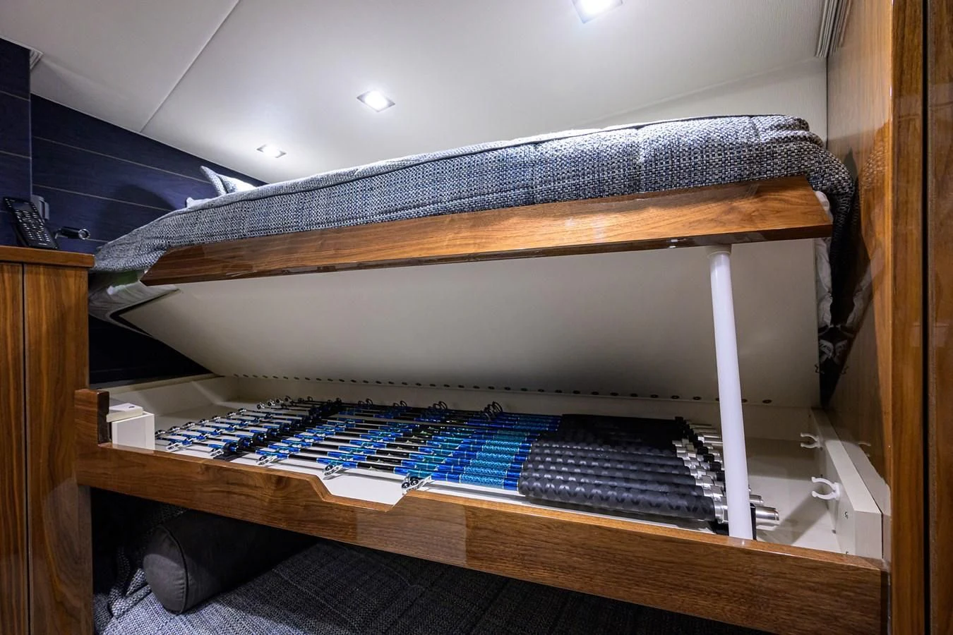 a bed with a blue cover aboard FORTY NINER Yacht for Sale