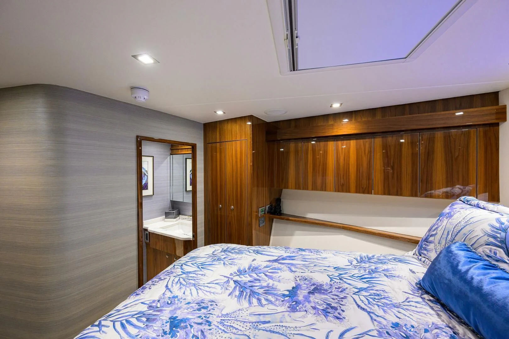 a bedroom with a bed and a mirror aboard FORTY NINER Yacht for Sale