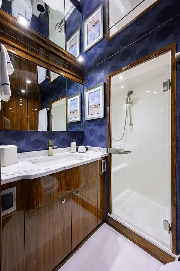 a bathroom with a large mirror aboard FORTY NINER Yacht for Sale