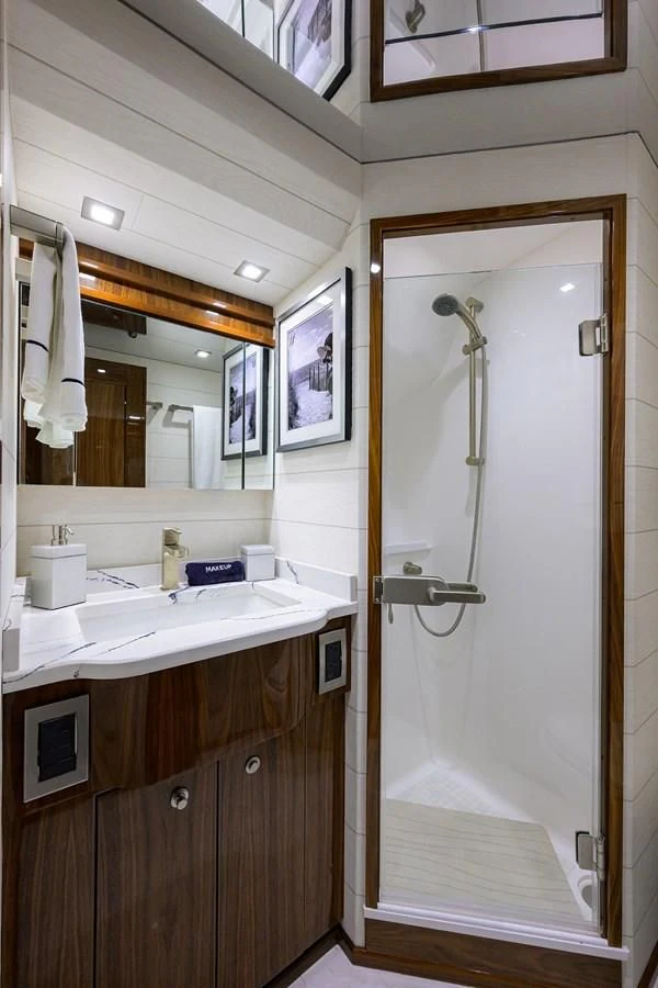 a bathroom with a shower unit and sink aboard FORTY NINER Yacht for Sale