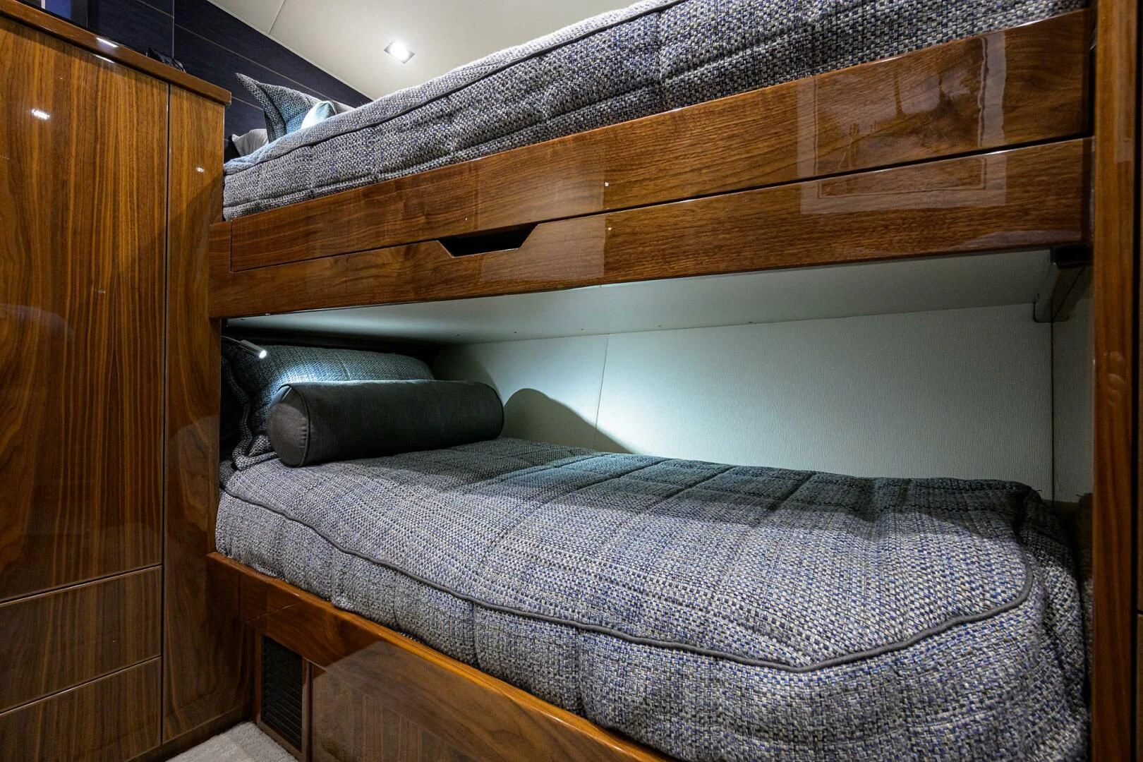 a bed with a wooden headboard aboard FORTY NINER Yacht for Sale