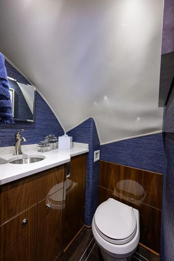 a bathroom with a toilet and a sink aboard FORTY NINER Yacht for Sale
