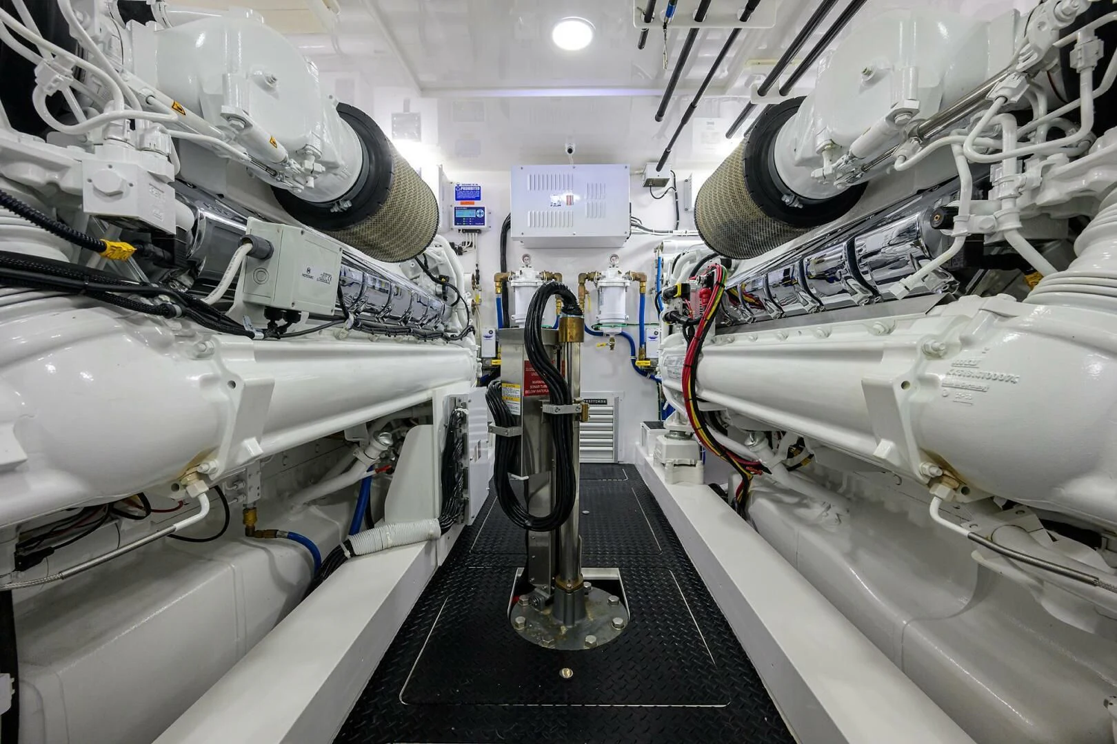 a room with white pipes and machinery aboard FORTY NINER Yacht for Sale