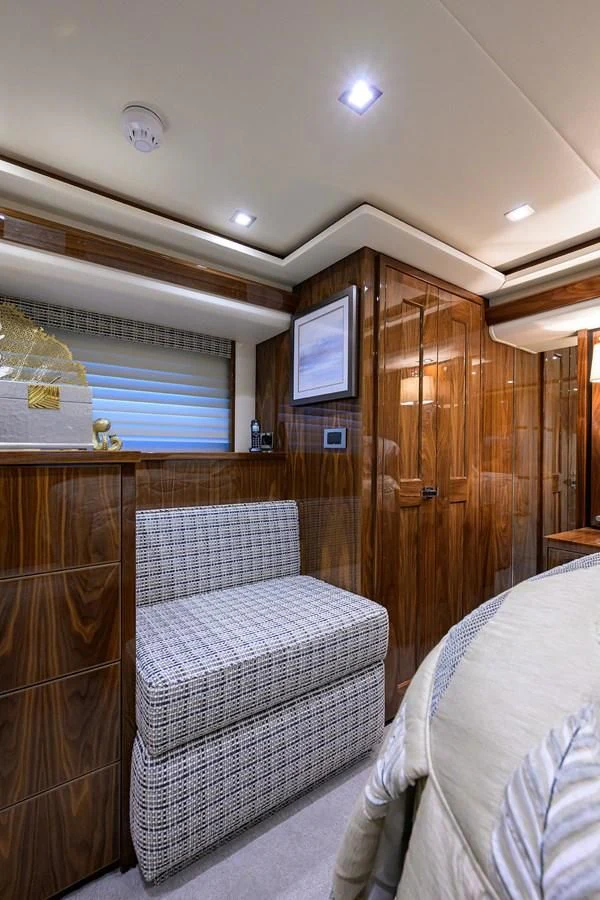 a bedroom with a bed and a closet aboard FORTY NINER Yacht for Sale