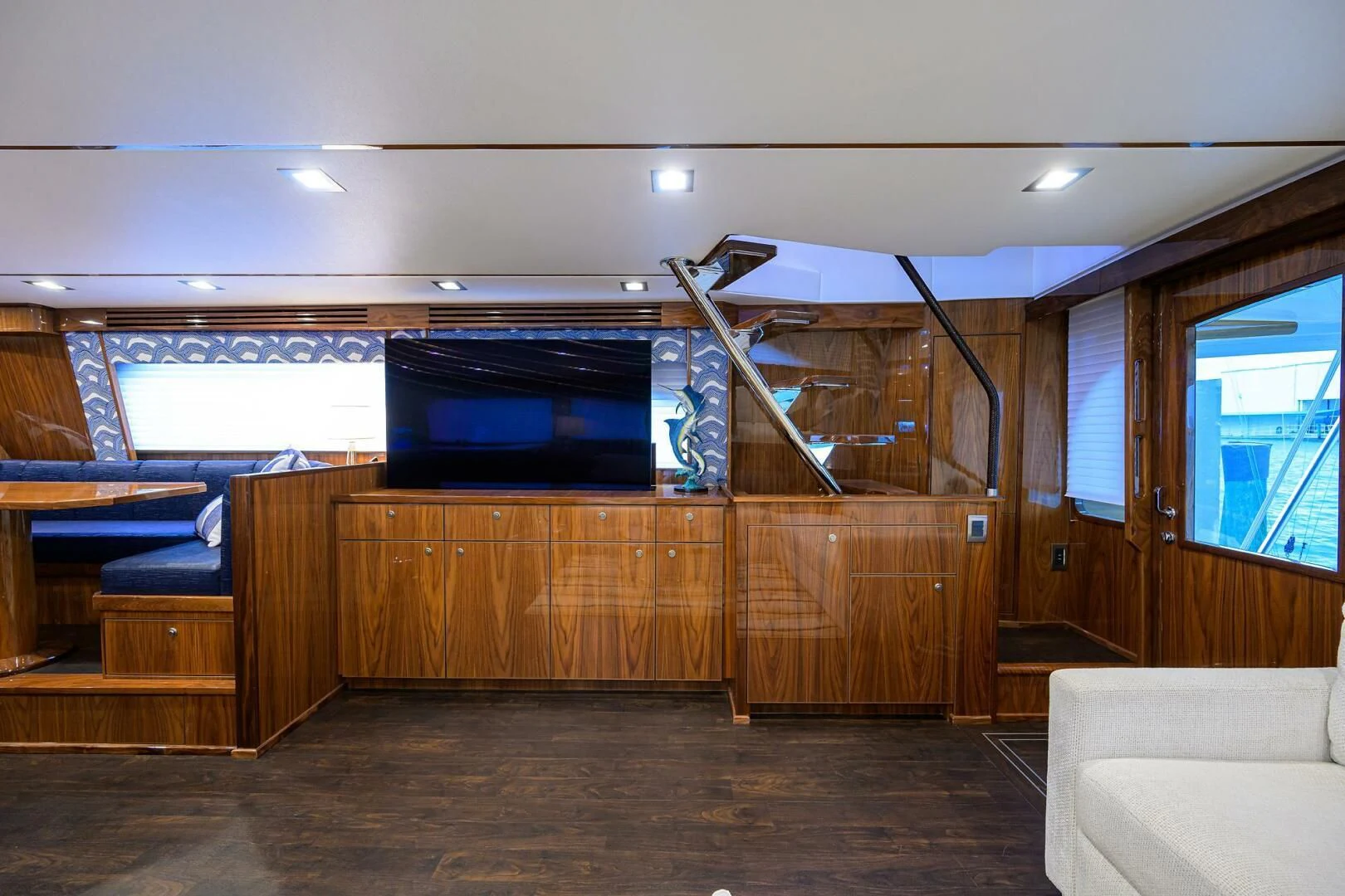 a room with a tv and couches aboard FORTY NINER Yacht for Sale
