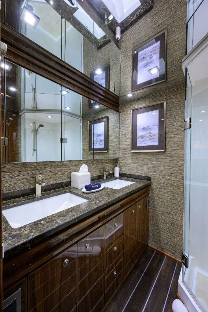 a bathroom with a large mirror aboard FORTY NINER Yacht for Sale