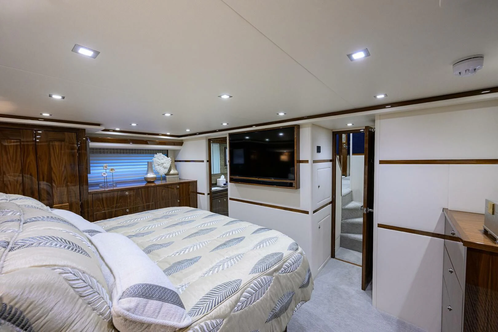 a bedroom with a bed and a television aboard FORTY NINER Yacht for Sale