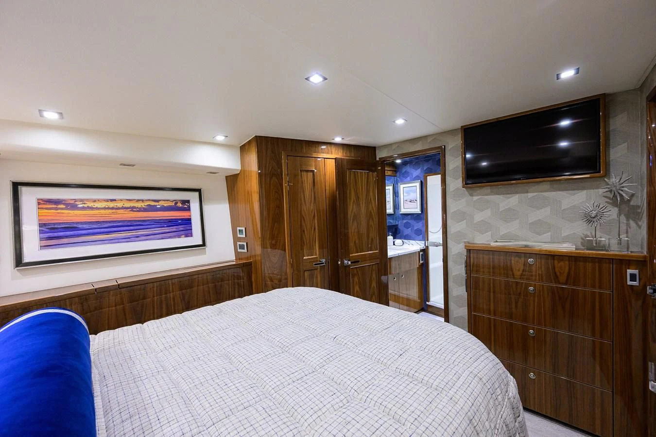 a bedroom with a bed and a television aboard FORTY NINER Yacht for Sale