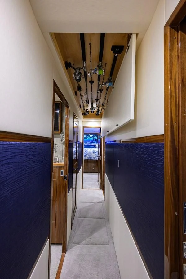 a hallway with blue walls aboard FORTY NINER Yacht for Sale