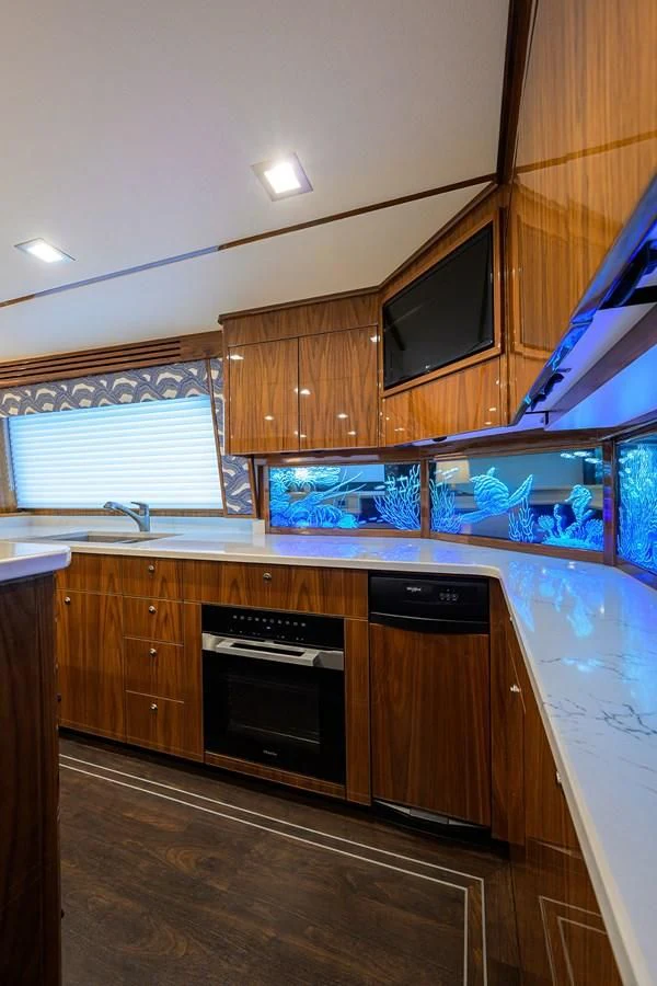 a kitchen with wooden cabinets aboard FORTY NINER Yacht for Sale