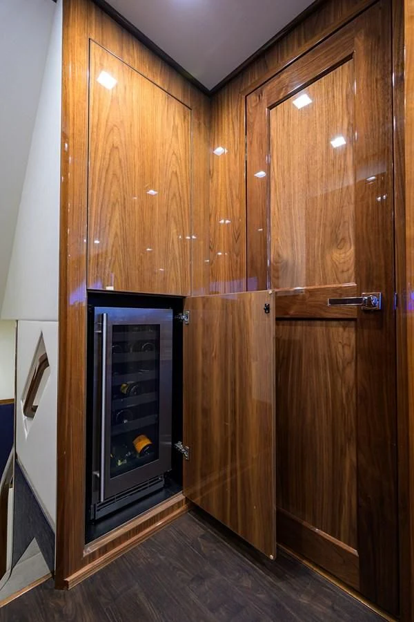 a wooden cabinet with a fireplace aboard FORTY NINER Yacht for Sale
