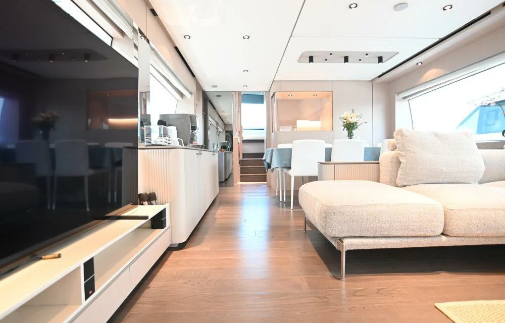 a living room with a wood floor aboard JOYOUS JOURNEY Yacht for Sale