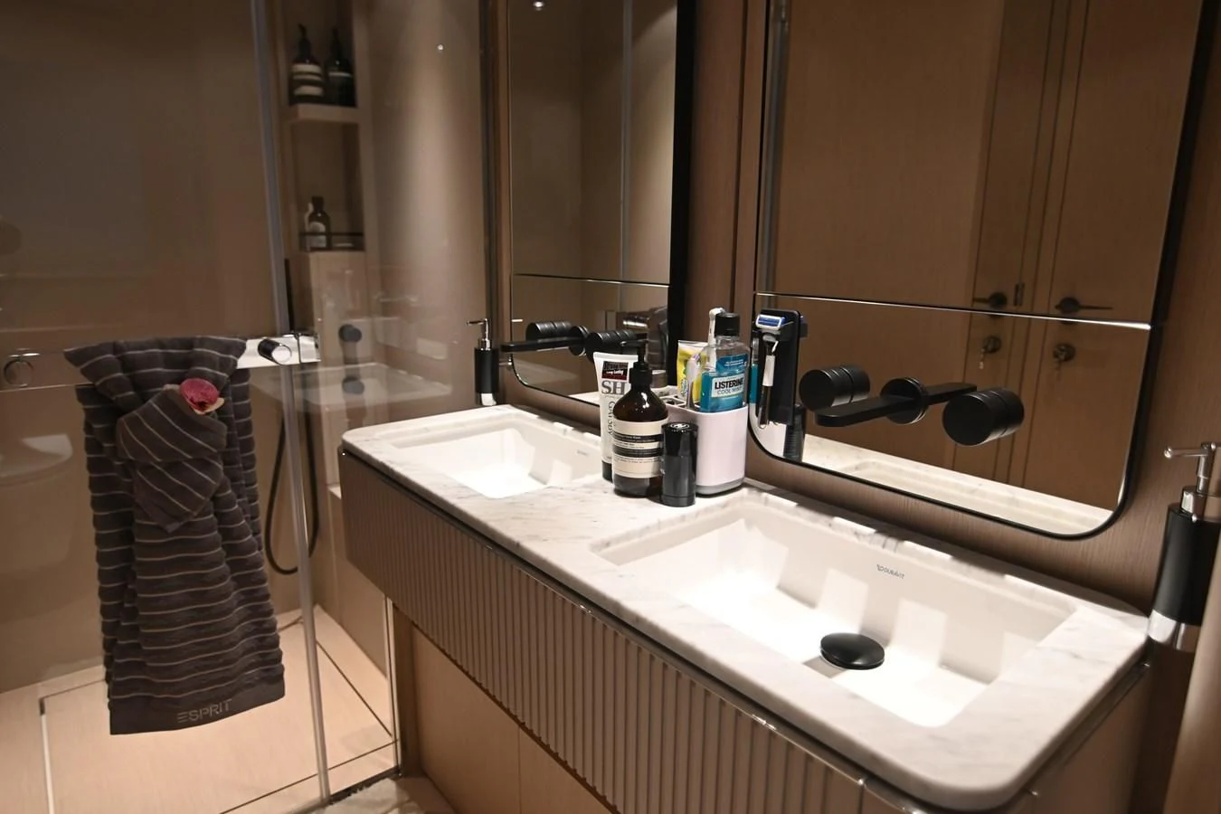 a bathroom with a sink and a towel on the wall aboard JOYOUS JOURNEY Yacht for Sale