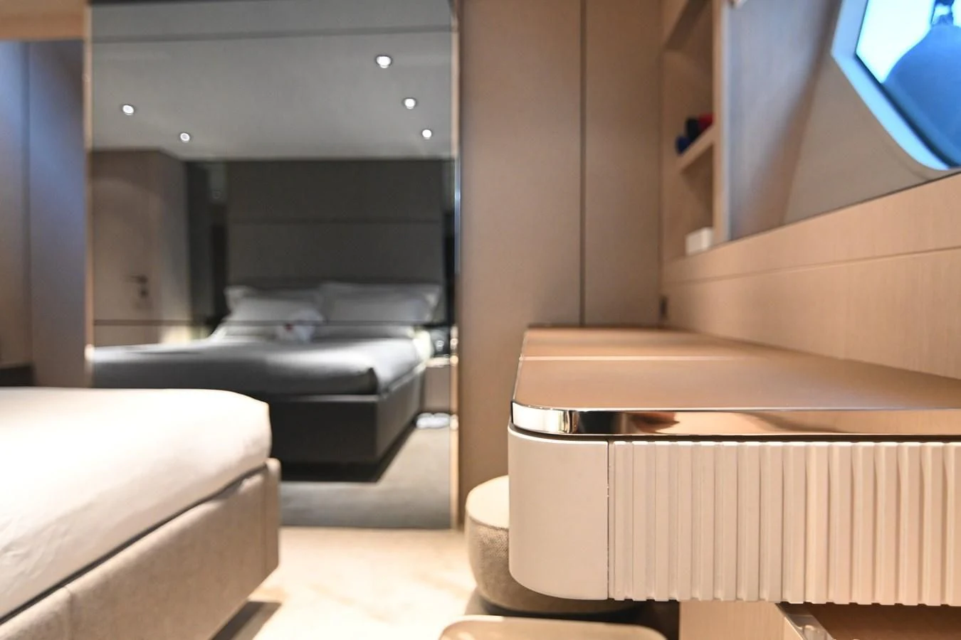 a room with a bed and a desk aboard JOYOUS JOURNEY Yacht for Sale