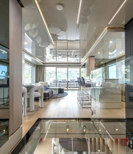 a large room with a large glass floor and a large window aboard CARITA Yacht for Sale