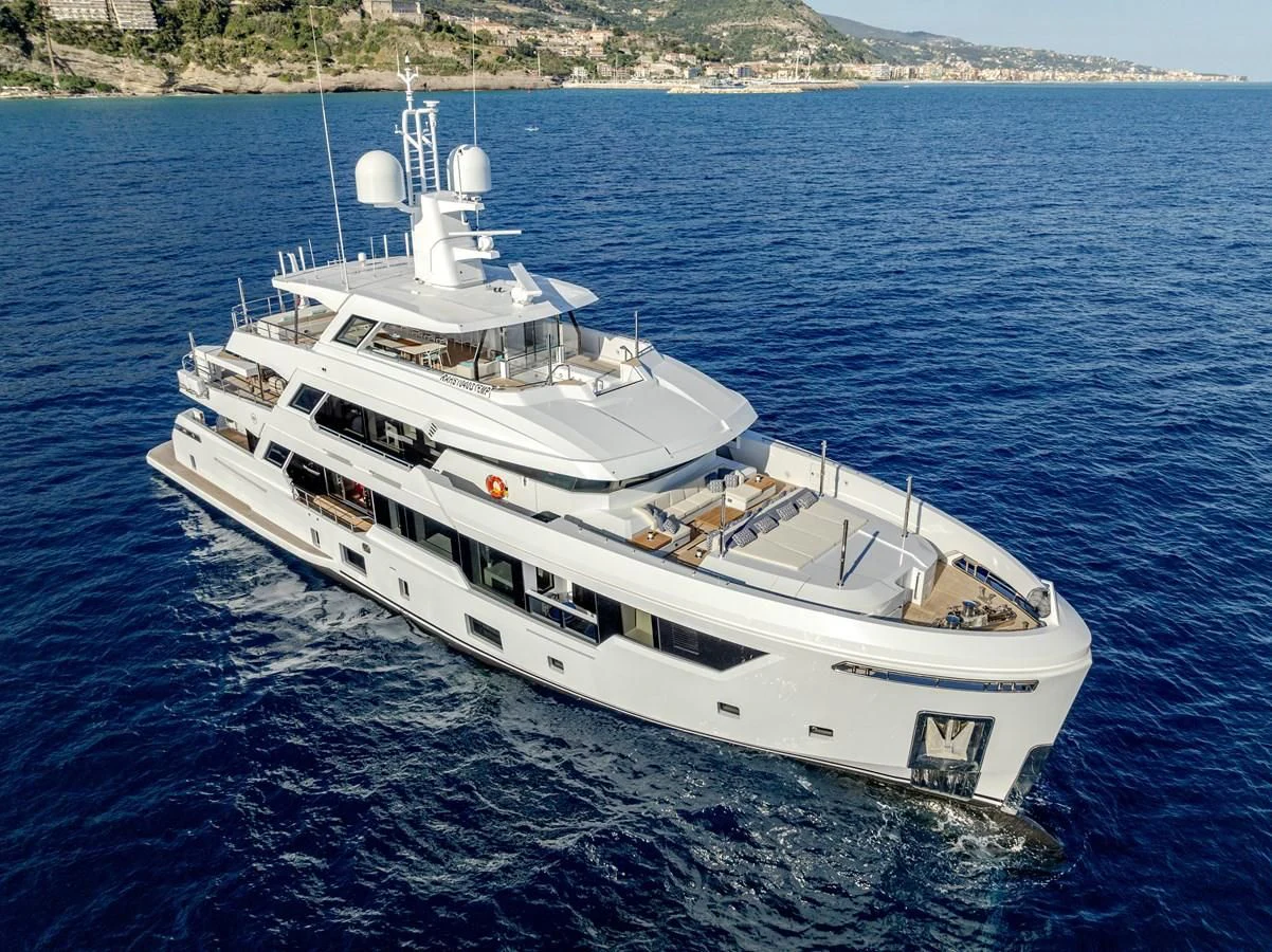 a large white ship in the water aboard CARITA Yacht for Sale