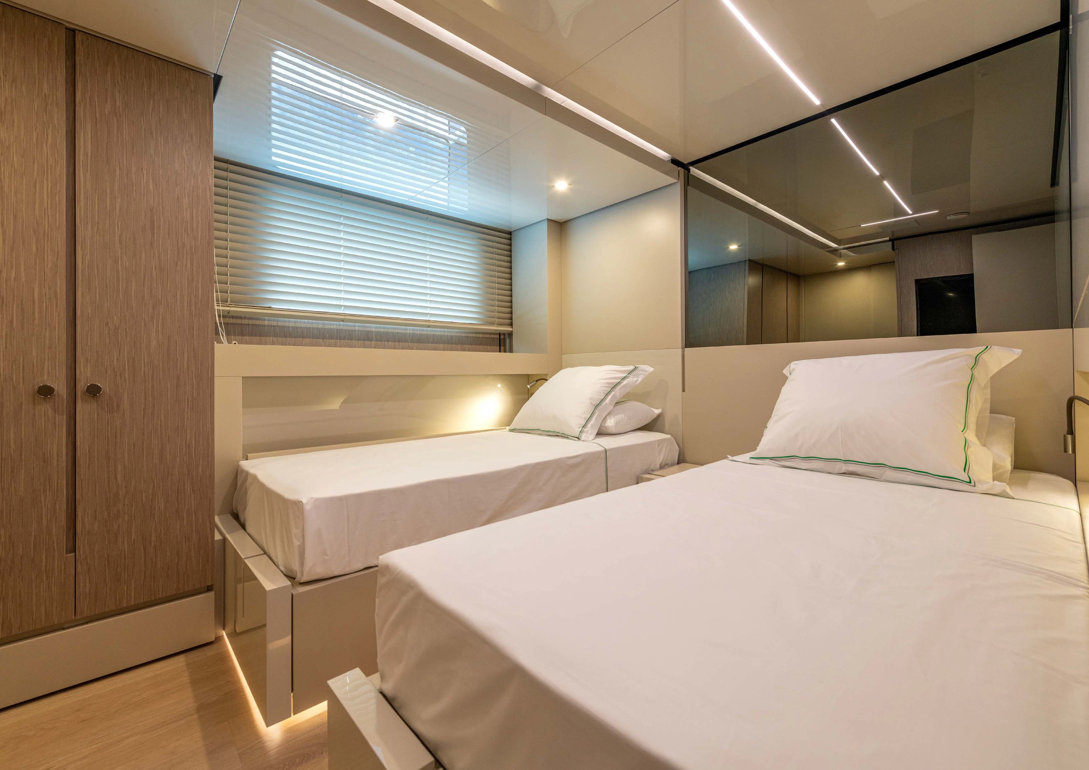 a room with two beds aboard CARITA Yacht for Sale