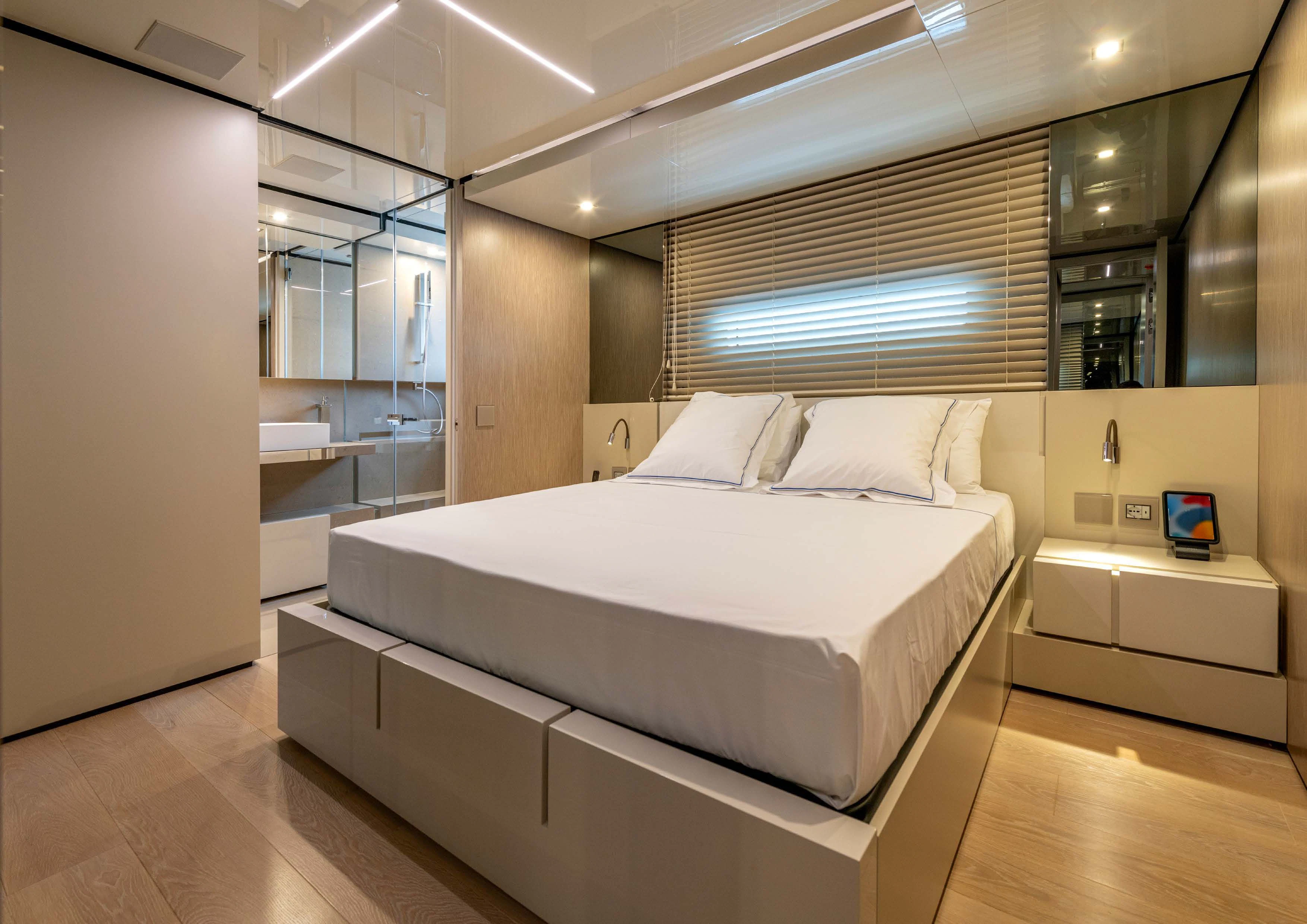 a large bedroom with a large bed aboard CARITA Yacht for Sale