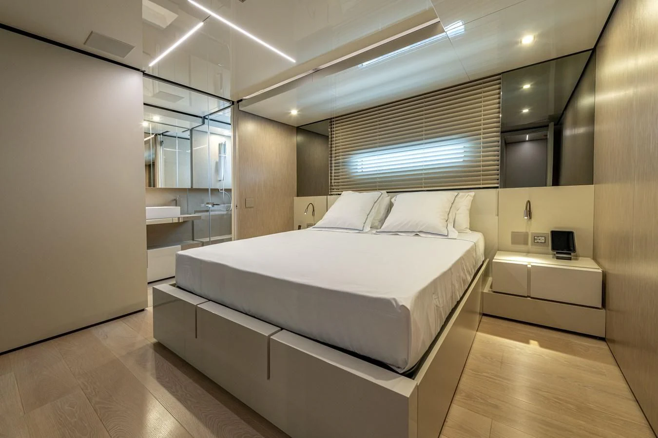 a room with a bed and a window aboard CARITA Yacht for Sale