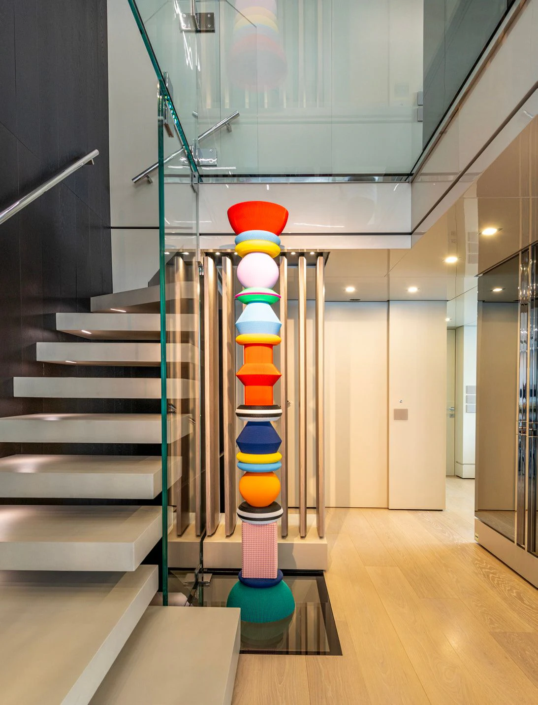 a staircase with a stack of books aboard CARITA Yacht for Sale