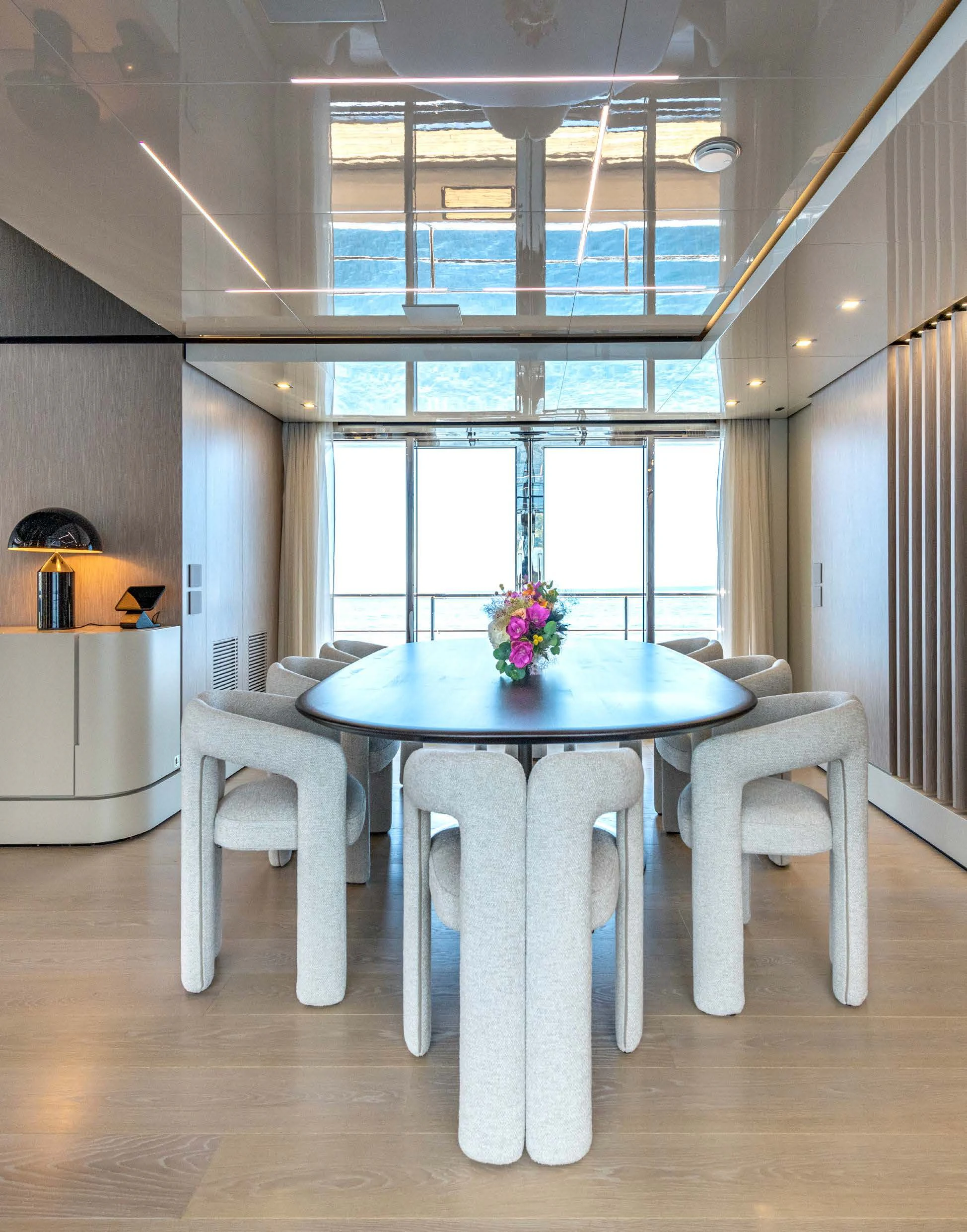 a room with a table and chairs aboard CARITA Yacht for Sale