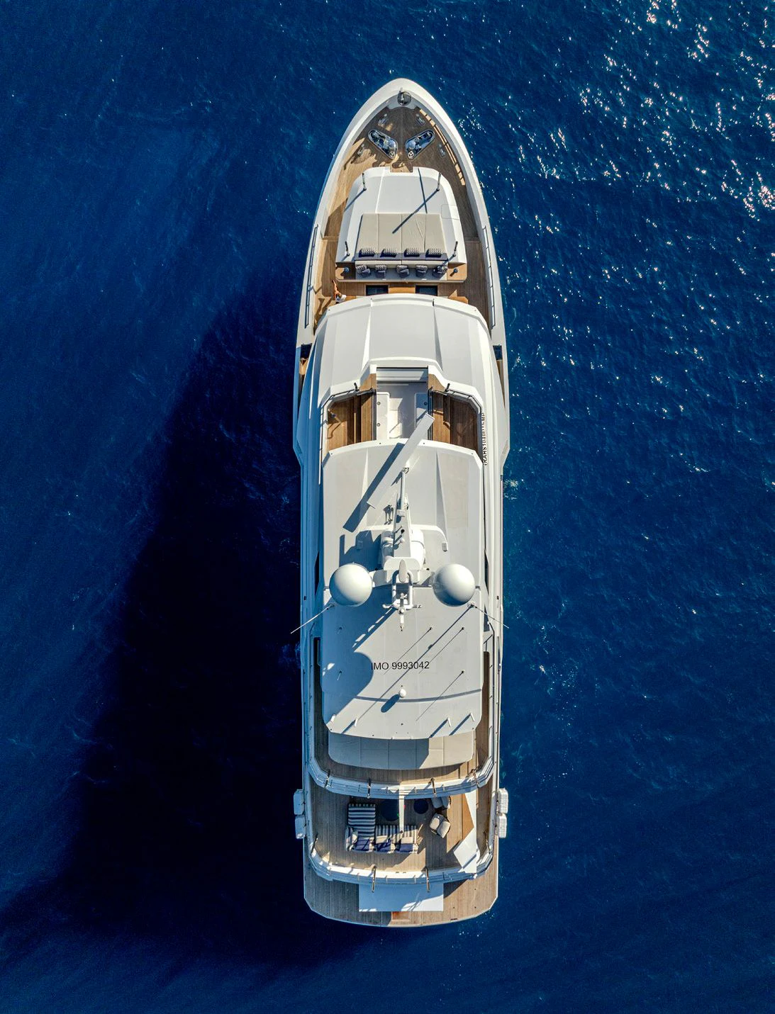 a white ship in the water aboard CARITA Yacht for Sale