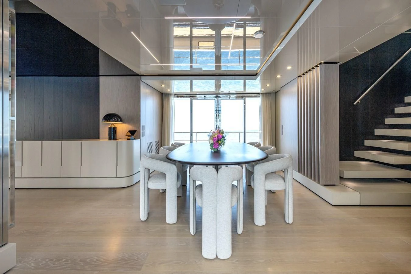 a room with a table and chairs aboard CARITA Yacht for Sale