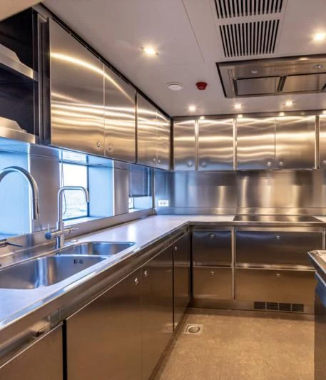 a kitchen with stainless steel appliances aboard CARITA Yacht for Sale