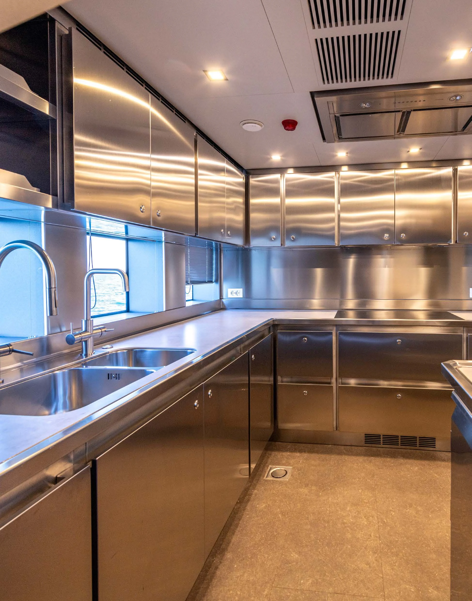 a kitchen with a large stainless steel sink aboard CARITA Yacht for Sale