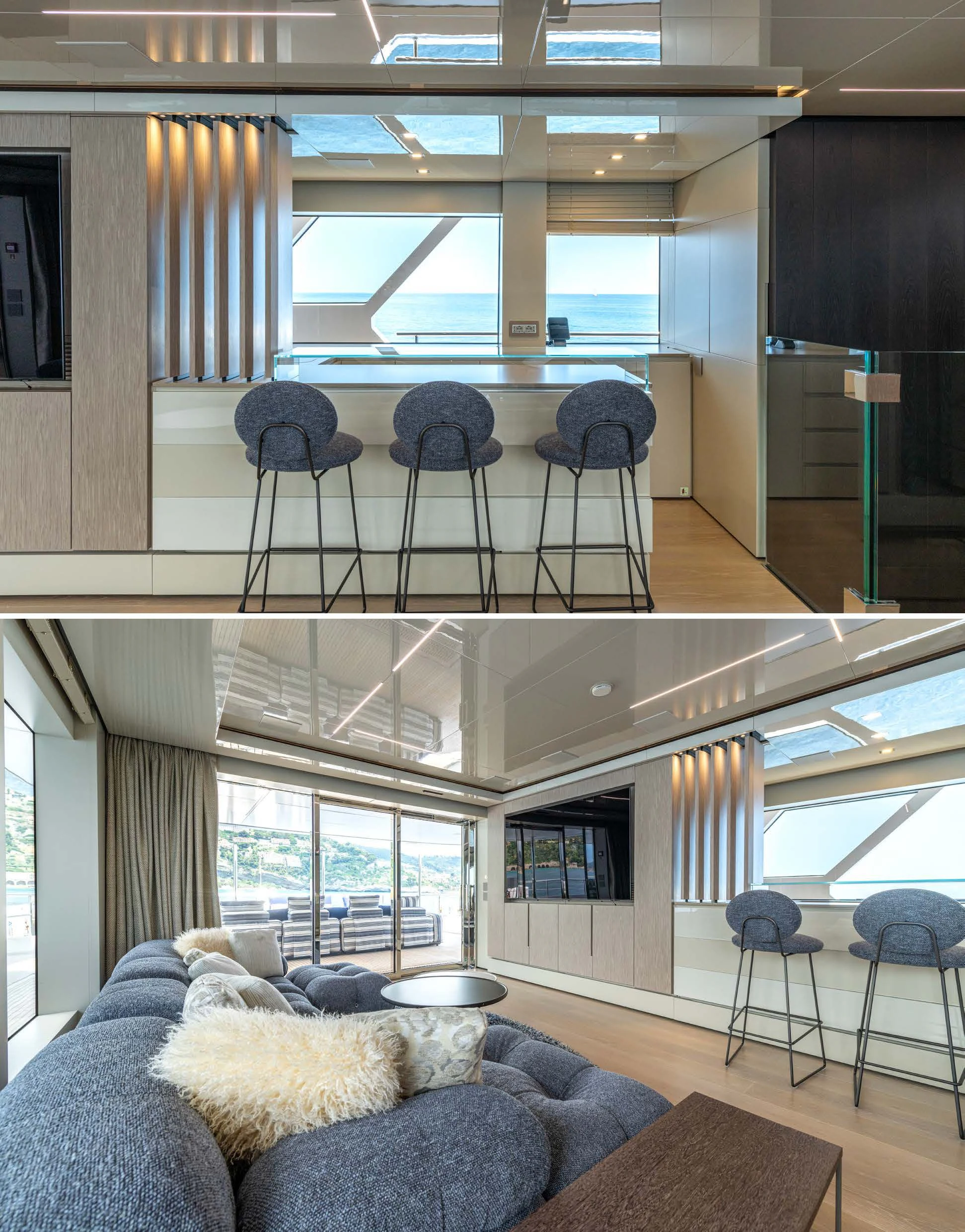 a living room with a large window aboard CARITA Yacht for Sale