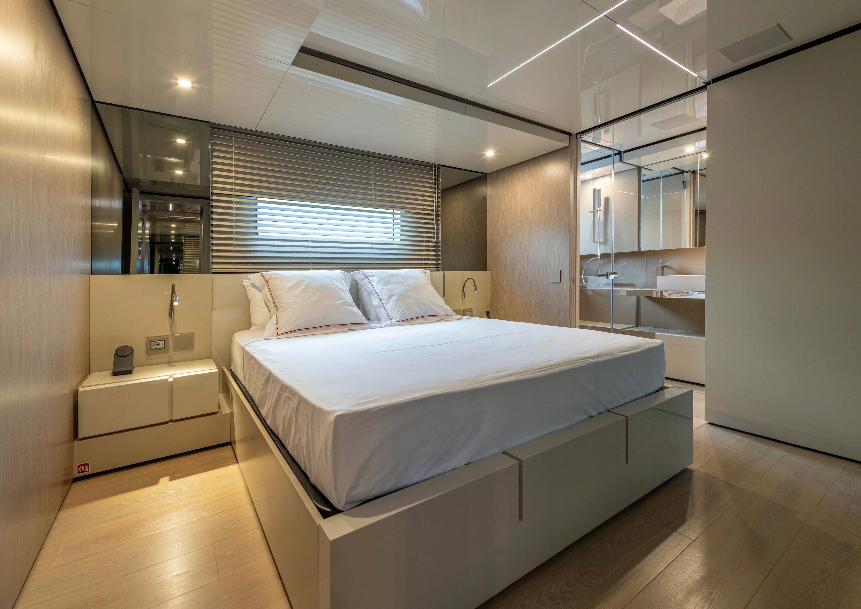 a large bedroom with a large bed aboard CARITA Yacht for Sale