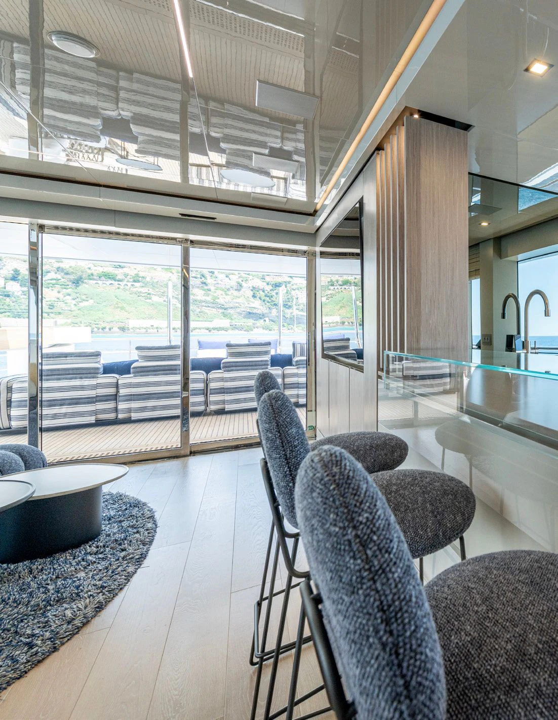 a room with a large glass window aboard CARITA Yacht for Sale