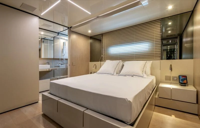 a room with a bed and a window aboard CARITA Yacht for Sale
