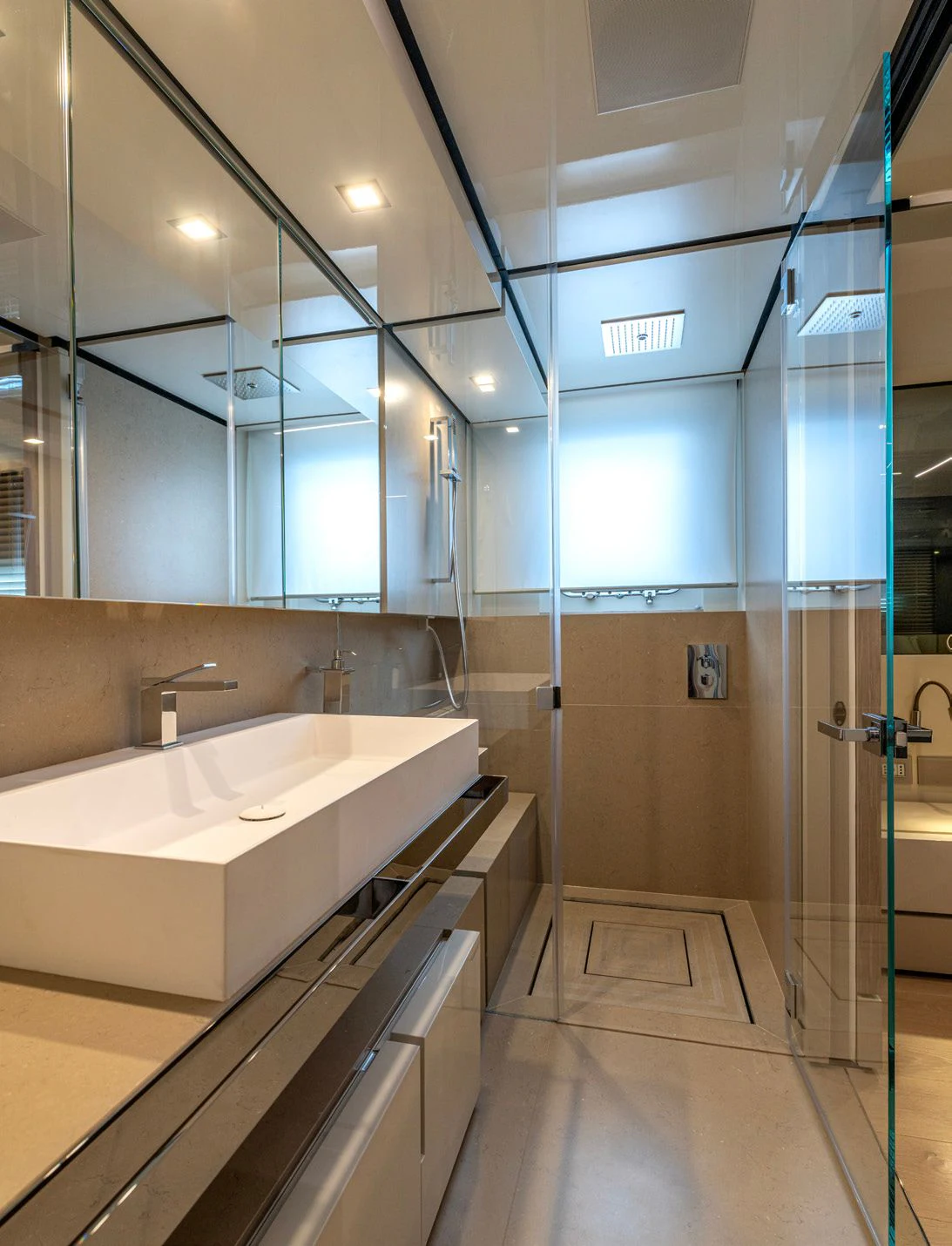 a bathroom with a large mirror aboard CARITA Yacht for Sale