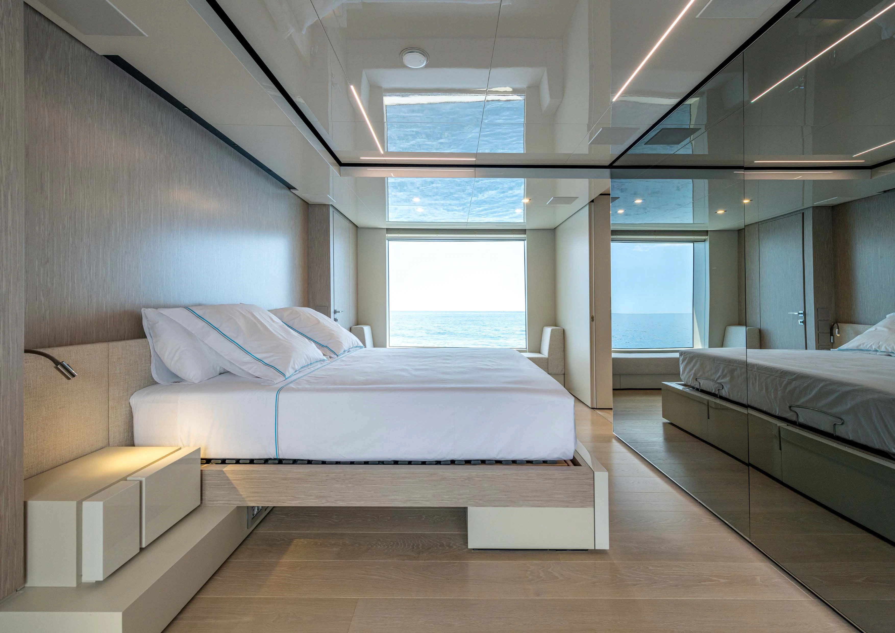 a room with a couple of beds aboard CARITA Yacht for Sale