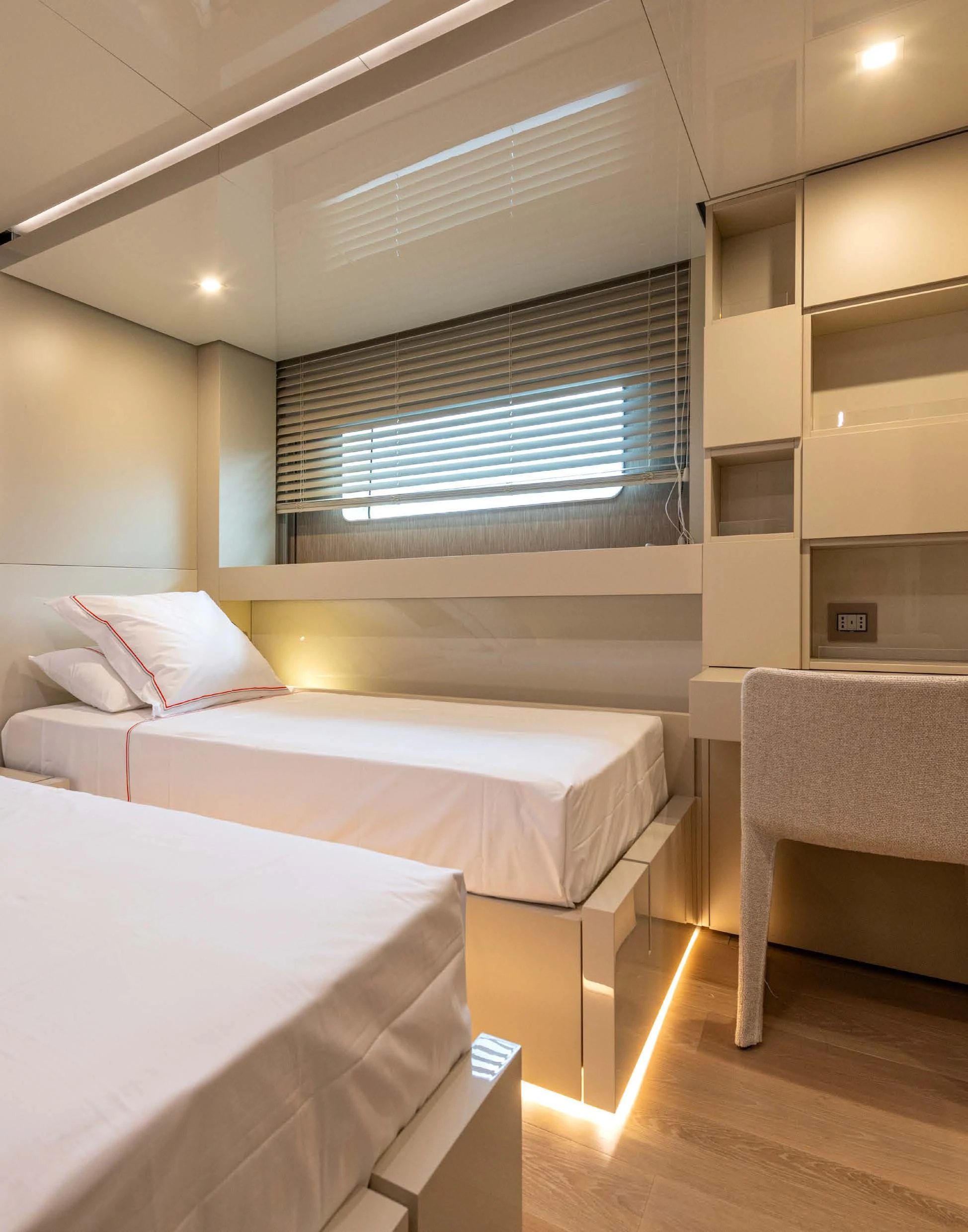 a room with a bed and a window aboard CARITA Yacht for Sale