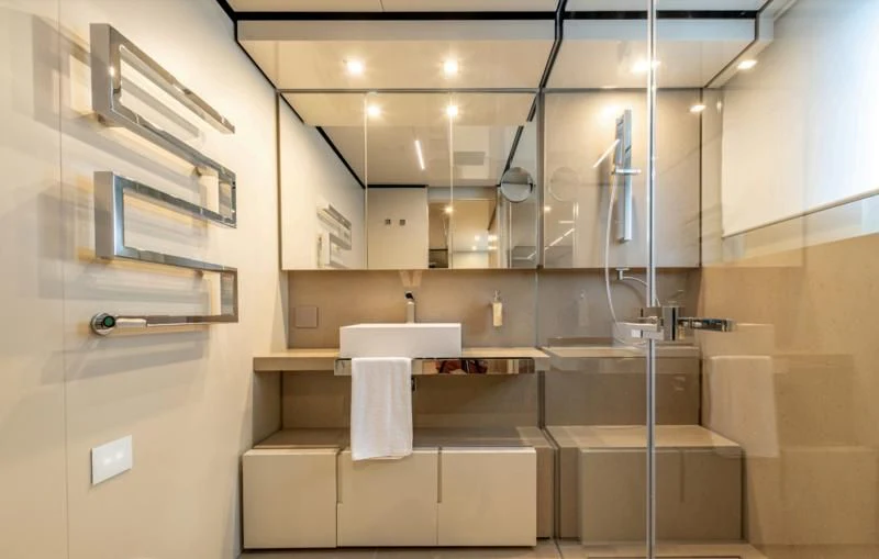 a bathroom with a sink and a mirror aboard CARITA Yacht for Sale