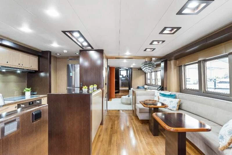 a kitchen with a wood floor aboard TEXAS T Yacht for Sale