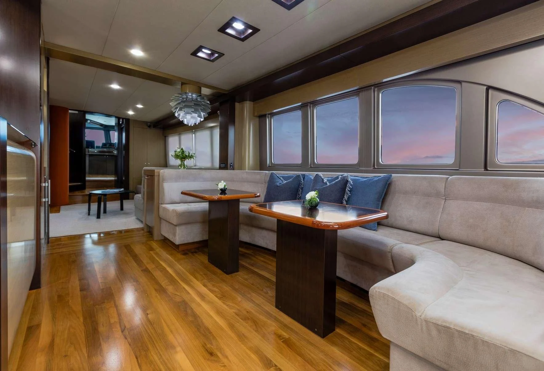 a living room with a couch and a coffee table aboard TEXAS T Yacht for Sale