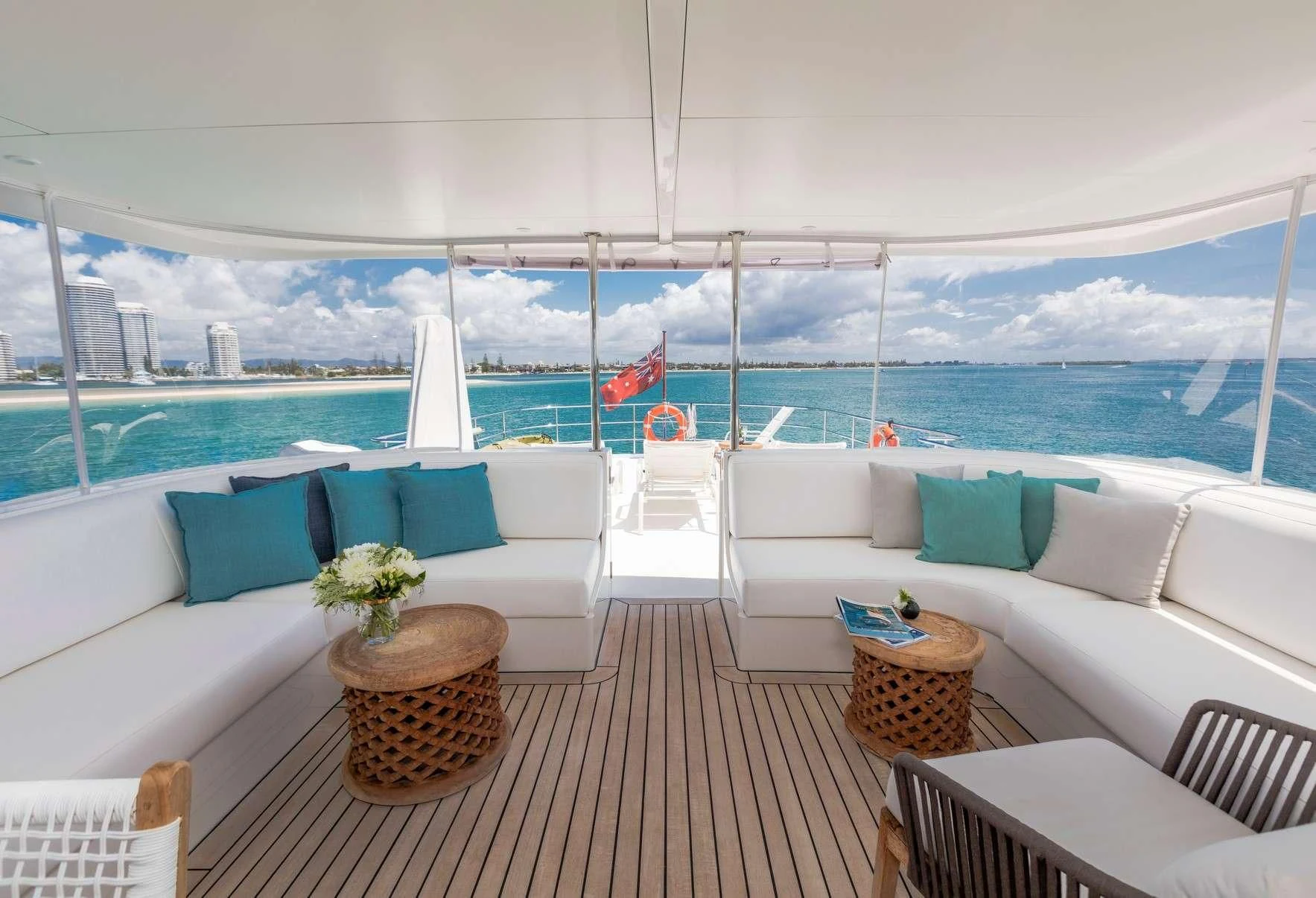 a room with a couch and a table and chairs aboard TEXAS T Yacht for Sale