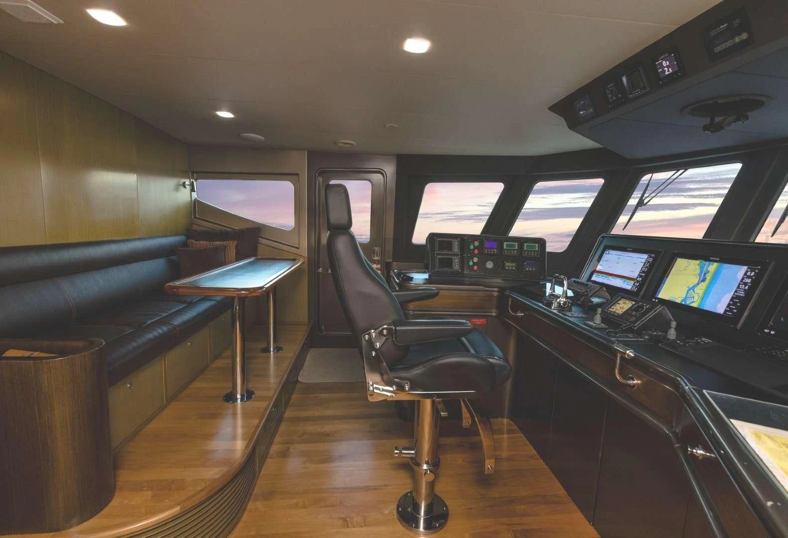 a room with a desk and chairs aboard TEXAS T Yacht for Sale