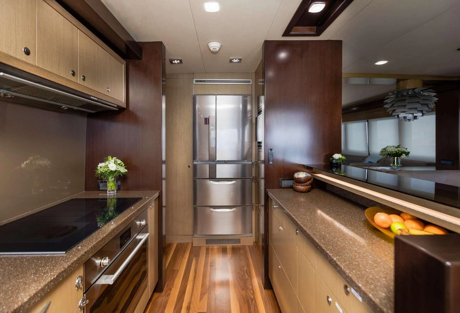 a kitchen with a large island aboard TEXAS T Yacht for Sale