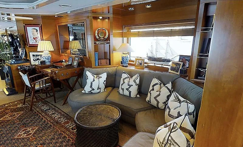 a living room with a leather couch aboard TURQUOISE Yacht for Sale