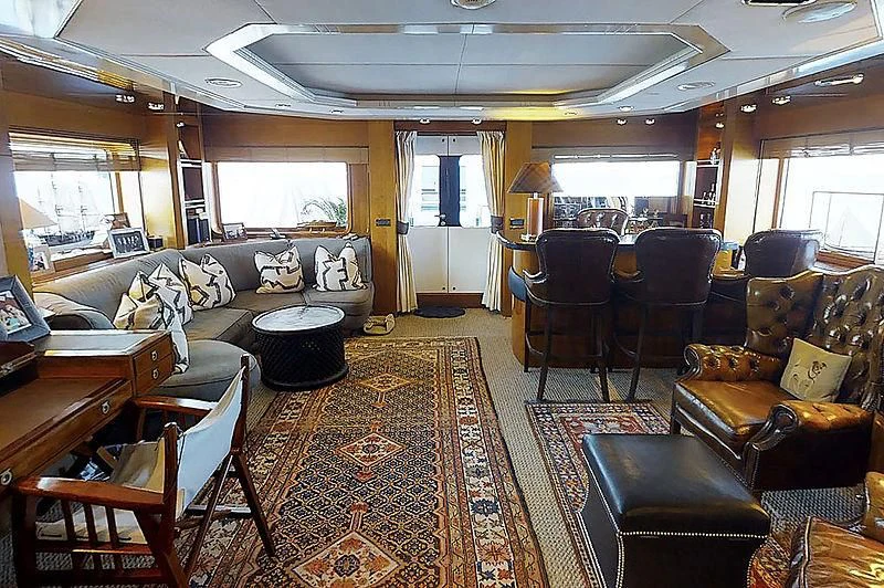 a living room with leather furniture aboard TURQUOISE Yacht for Sale
