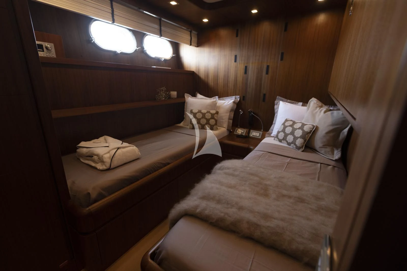 a room with two beds aboard XUMI Yacht for Charter