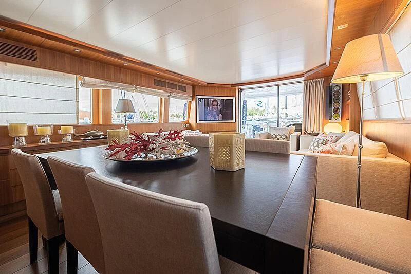 a large dining room with a large table and chairs aboard XUMI Yacht for Charter