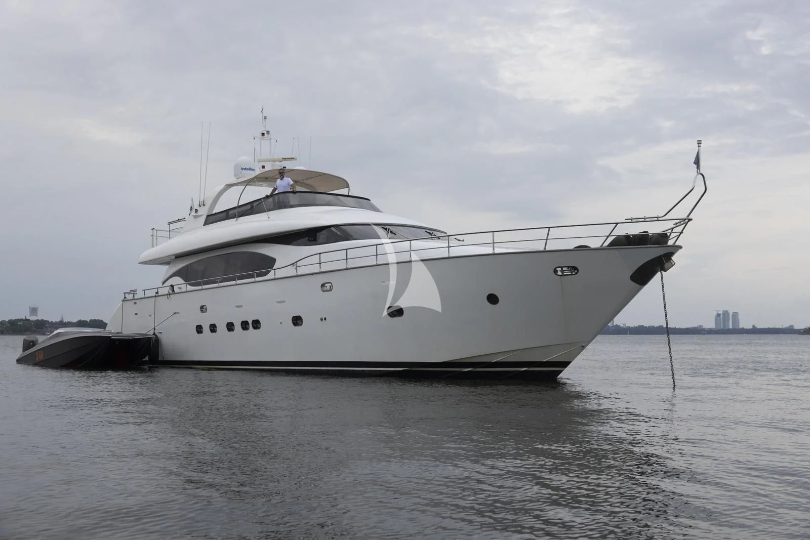a white yacht in the water aboard XUMI Yacht for Charter