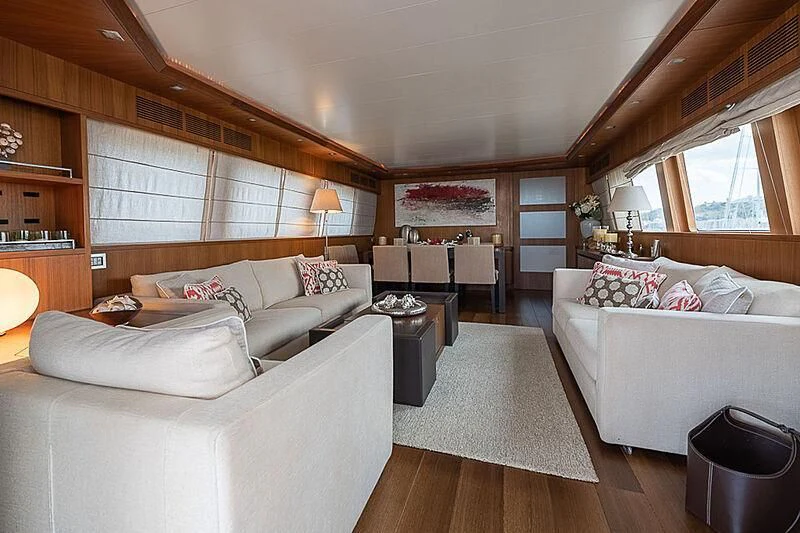 a large bedroom with a bed and a couch aboard XUMI Yacht for Charter