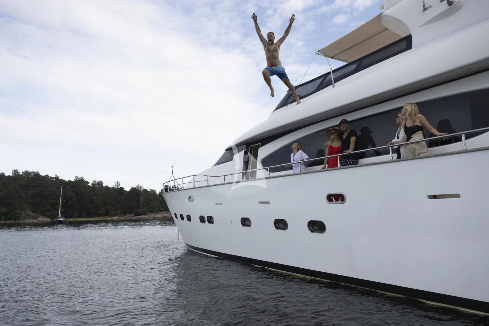 a group of people on a boat aboard XUMI Yacht for Charter